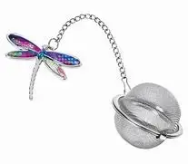 Hummingbird tea infuser with stainless steel mesh ball and colorful decorative charm beside a teacup