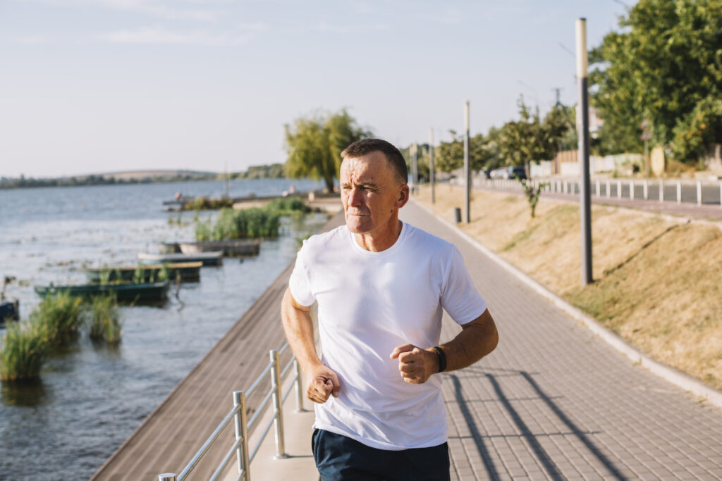 A middle aged man running 